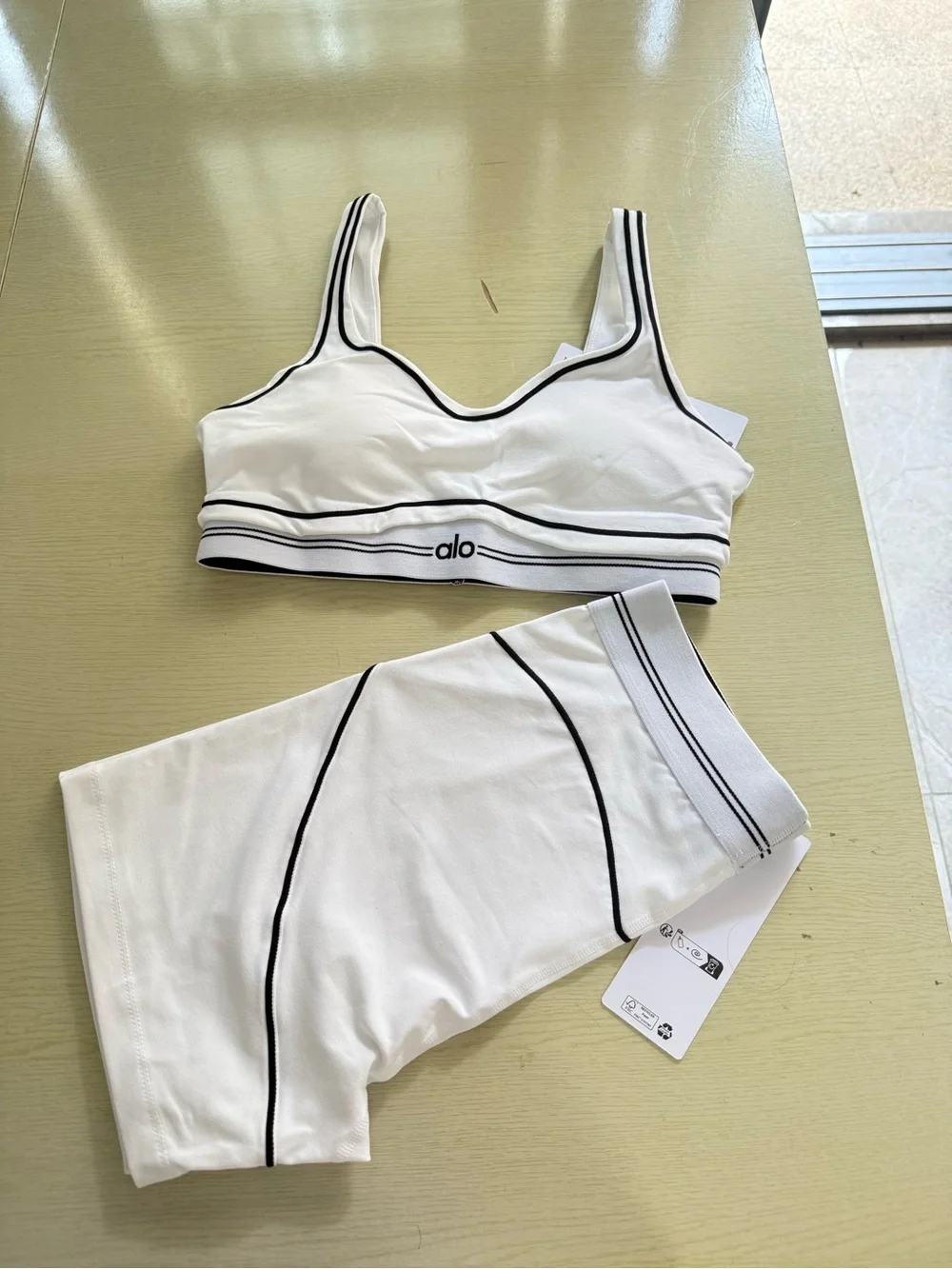 ALO Yoga White Sports Bra & Matching Shorts with Black Seam Detail